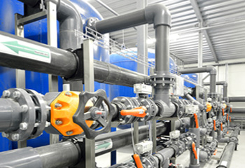 Valves and pipework in a commercial water treatment plant room